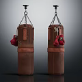 Two Brown Leather Boxing Punching Bags with Red Gloves Hanging as Sports Equipment