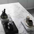 Minimalist Modern Tabletop Decor With Black Bottles Books And Bulb Decor On Marble Surface
