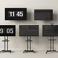 Multiple Televisions Some Wall Mounted and Some on Wheeled Stands Showing Time