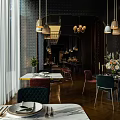 Elegant Restaurant Interior With Pendant Lights Dining Tables Green Plants And Marble Table Tops
