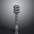 Ornate Decorative Column With Intricate Layered Carvings And Metallic Surface Against Dark Background