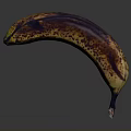 Close Up Image Of Overripe Banana With Brown Spots On Gray Background