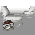 Modern Accent Chair Featuring Metal Wire Frame Light Gray Linen Upholstery And Stack Of Books