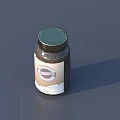 Spice Jar With Green Lid Containing Dark Powdered Spices Round Logo Label On Gray Background
