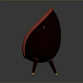 Red Patterned Oval Shaped Chair With Wooden Legs And Golden Accents