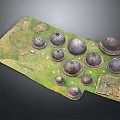 Domed Towers of Various Sizes Standing on Green Grassland With Small Structures