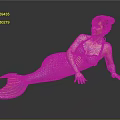 Red Haired Woman In Green And Yellow Mermaid Tail Lying On Black Smooth Surface