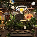 Cozy Restaurant Interior With Globe Lights String Lights Lush Green Plants And Wooden Seating