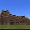 Classic Red Brick Multi Story School Building With Gabled Roofs Front Lawn Against Blue Sky