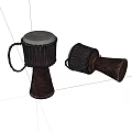 Two Handmade Dark Brown Drums with Carved Patterns and White Drumheads Standing and Lying