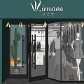 Mimoes Clothing Store Green Facade Glass Doors Window Display With Dresses And Cactus