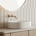 Modern Bathroom Washbasin With Round Mirror Gold Faucet And Vertical Striped Tile Wall