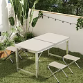 Outdoor Foldable Table with White Tabletop on Grass Lawn Green Plants Stools and String Lights 3d model