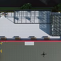 Red And White School Building Exterior With Glass Curtain Walls Staircase Green Plants And Vehicles