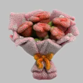 Pink Fluffy Flower Bouquet Art Installation Wrapped In Pink Paper With Orange Yellow Bow