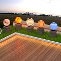 Decorative Outdoor Lights With Spherical Planet Themed Design On Wooden Deck In Twilight Grass Area