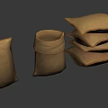 Brown Fabric Bags And Stacked Pillows In Various Shapes On Gray Background