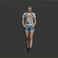 Woman with braided pigtails wearing light blue graphic T-shirt denim shorts and gray shoes