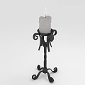 Black Metal Candle Lamp With Decorative Scrollwork And Lit White Candle