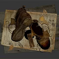 Vintage Leather Boots With Studded Soles On Wooden Pallet And Old Newspaper