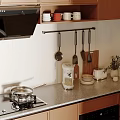 Modern Kitchen With Wooden Cabinets Hanging Utensils Countertop Dishes And Small Plant