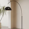 Black Arched Floor Lamp With Dome Shade And Plant Near Light Colored Wall
