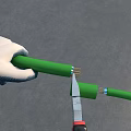 Man Wearing White Gloves Carefully Cutting Green Pipe With Utility Knife