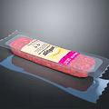 Packaged Salami Product In Transparent Plastic Wrapper With Red Meat Inside
