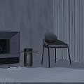 Modern Gray Accent Chair With Metal Legs And Round Side Table Near Beige Curtains