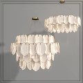 White Leaf Shaped Chandeliers with Golden Metal Frames Against Gray Wall Interior Design