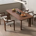Modern Wooden Dining Table With Upholstered Chairs And Fruit Bowls In Bright Room