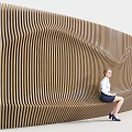 Modern Outdoor Bench With Wavy Wooden Slats Design For Comfortable Sitting In Stylish Space