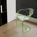 Modern Transparent Green Acrylic Chair With Curved Armrests And Wooden Floor Interior