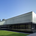 Contemporary Modern Building With Skylight Roof Glass Facade And Greenery