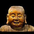 Ancient Ornate Sculpture Carving With Head Ornamental Carvings Large Ears And Aged Golden Patina