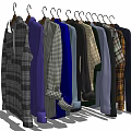 Stylish Hanging Clothes With Various Colors And Patterns On Wooden Hangers