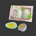Free Range Chicken Eggs Halved Boiled with Carton and Green Leaf