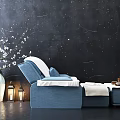 Blue Massage Chair With White Vase Blossoms Lanterns And Tea Set On Side Table