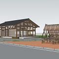 Traditional Wooden Post Station Exterior With Green Trees Thatch Roofed Shelter And Picnic Tables