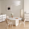 Modern Restaurant Interior With White Round Table Beige Chairs Flowers In Vase And Wall Painting