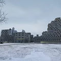 Modern Geometric Office Building In Snowy Winter Landscape With Bare Trees