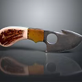 Handcrafted Metal Blade Knife Featuring Wooden Handle And Circular Hole Design