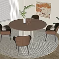 Round Wooden Dining Table Set with Four Brown Chairs on Striped Rug and Plants