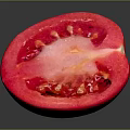 Fresh Halved Tomato with Red Juicy Flesh Seeds and Central Core on Dark Surface