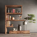 Wooden Display Cabinet With Shelves Holding Books Decorative Items And Bonsai Plant