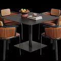 Modern Square Black Dining Table and Chair Set with Brown Woven Design and Fruit Bowl