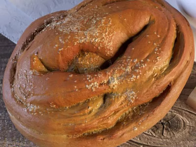 Freshly Baked Golden Braided Bread With Sesame Seeds On Wooden Serving Board 3d model
