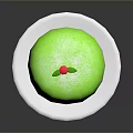 Fresh Green Cake on White Plate with Red Cherry and Green Leaf Topping