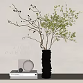 Modern Black Stacked Vase With Green Foliage And Twigs For Interior Decor