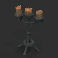 Sculpted Metal Candelabra Design with Three Lit Candles and Wax Drips